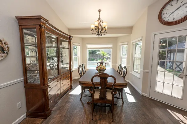 a view of a dining room with furniture window and wooden floor