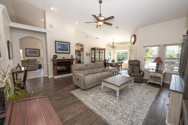 a living room with furniture and a fireplace