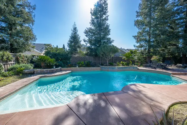 a view of swimming pool with a yard