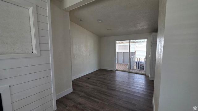 1450 North Dixie Downs Road, Unit 51 St. George, UT 84770 - Photo 22 of 25 Spacious room featuring wood-finish flooring, recessed lighting, and a sliding glass door leading to an outdoor deck