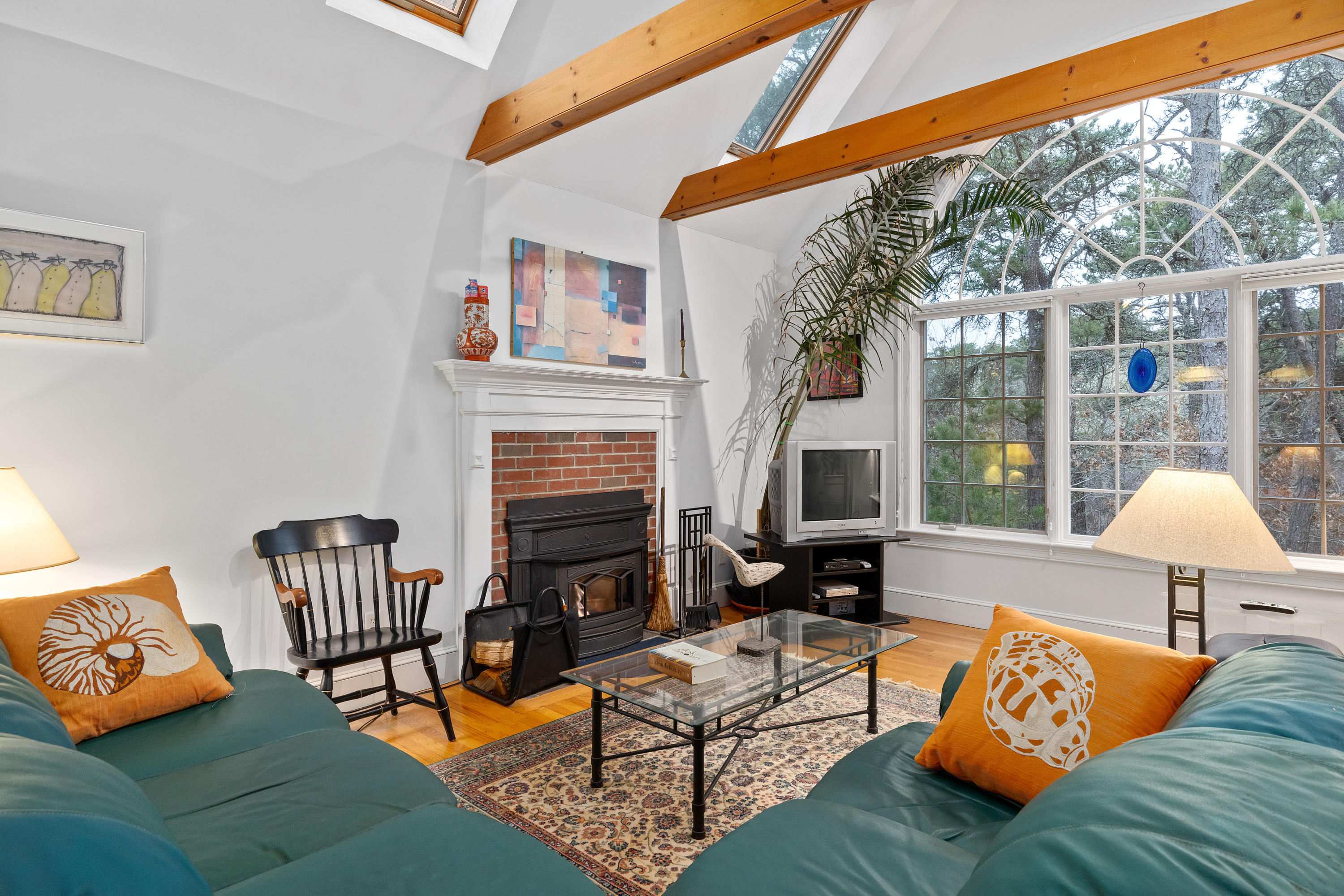 3 Parsons Path Harwich, MA 02645 - Photo 12 of 62 a living room with furniture and a fireplace
