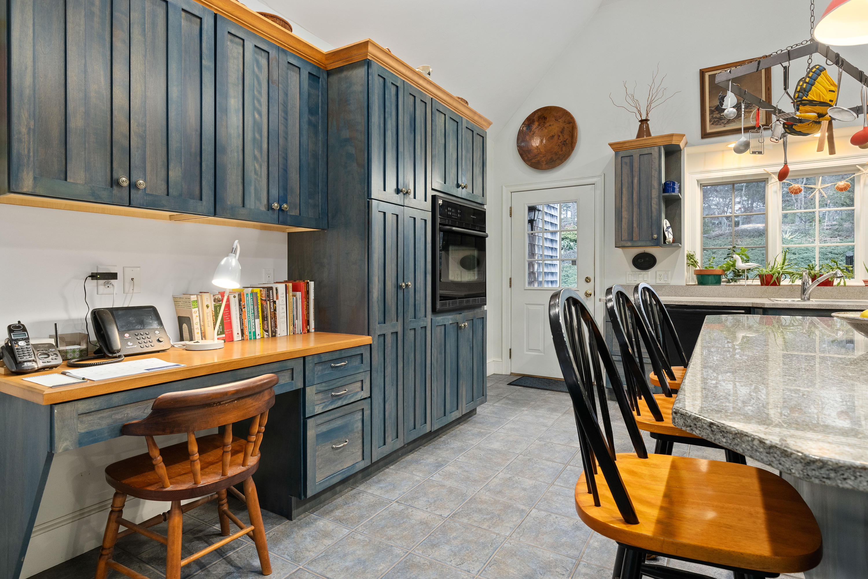 3 Parsons Path Harwich, MA 02645 - Photo 14 of 62 a dining room with furniture a rug a fireplace and a window