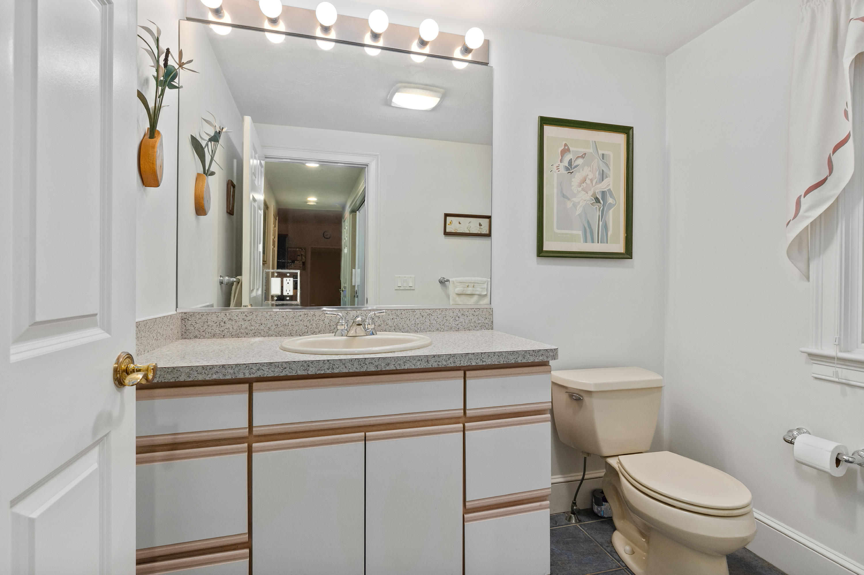 3 Parsons Path Harwich, MA 02645 - Photo 20 of 62 a bathroom with a granite countertop toilet sink and mirror