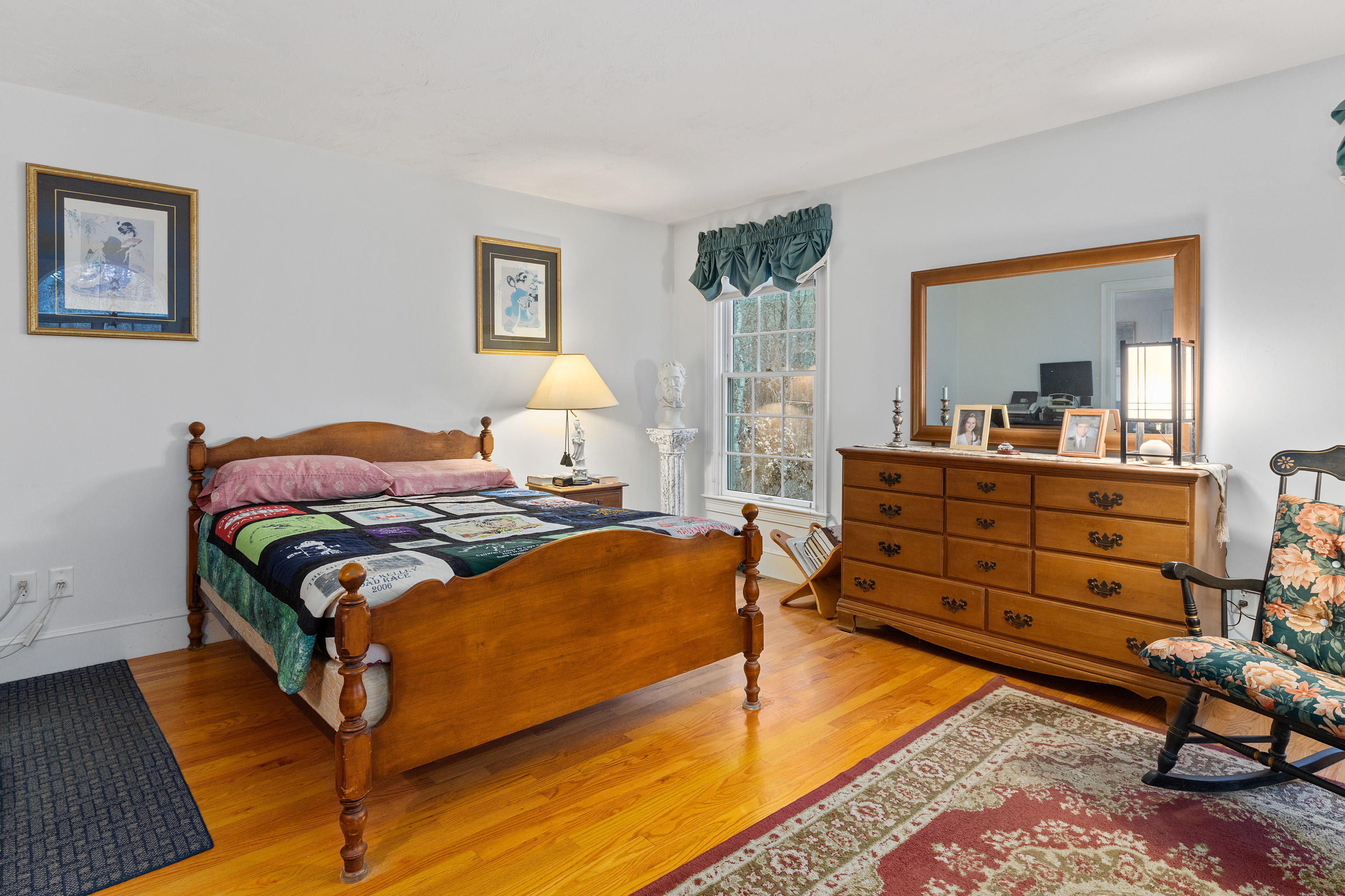 3 Parsons Path Harwich, MA 02645 - Photo 21 of 62 a bedroom with a bed and wooden floor