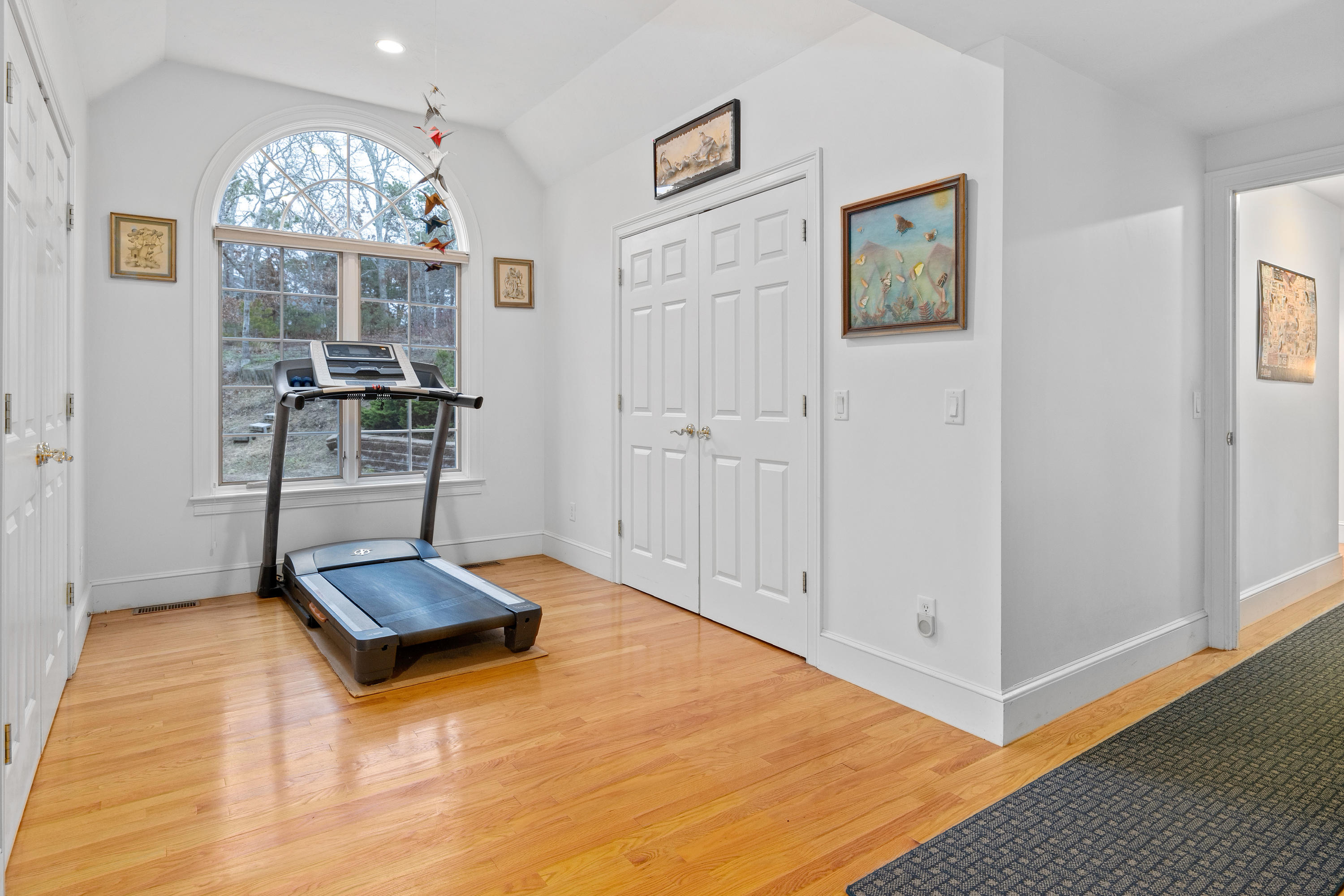 3 Parsons Path Harwich, MA 02645 - Photo 24 of 62 a living room with couch and a chandelier