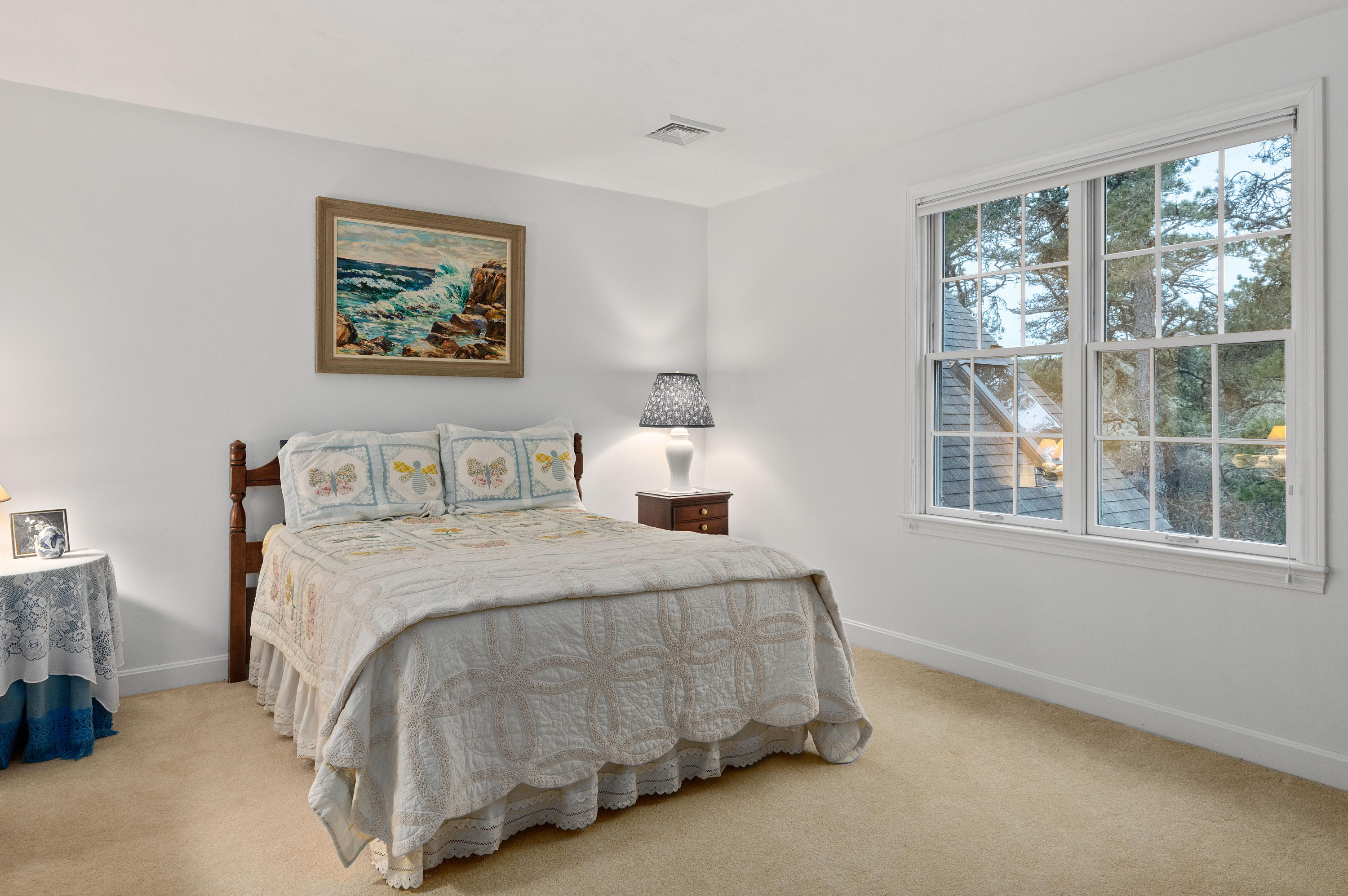 3 Parsons Path Harwich, MA 02645 - Photo 27 of 62 a bedroom with a bed lamp and window