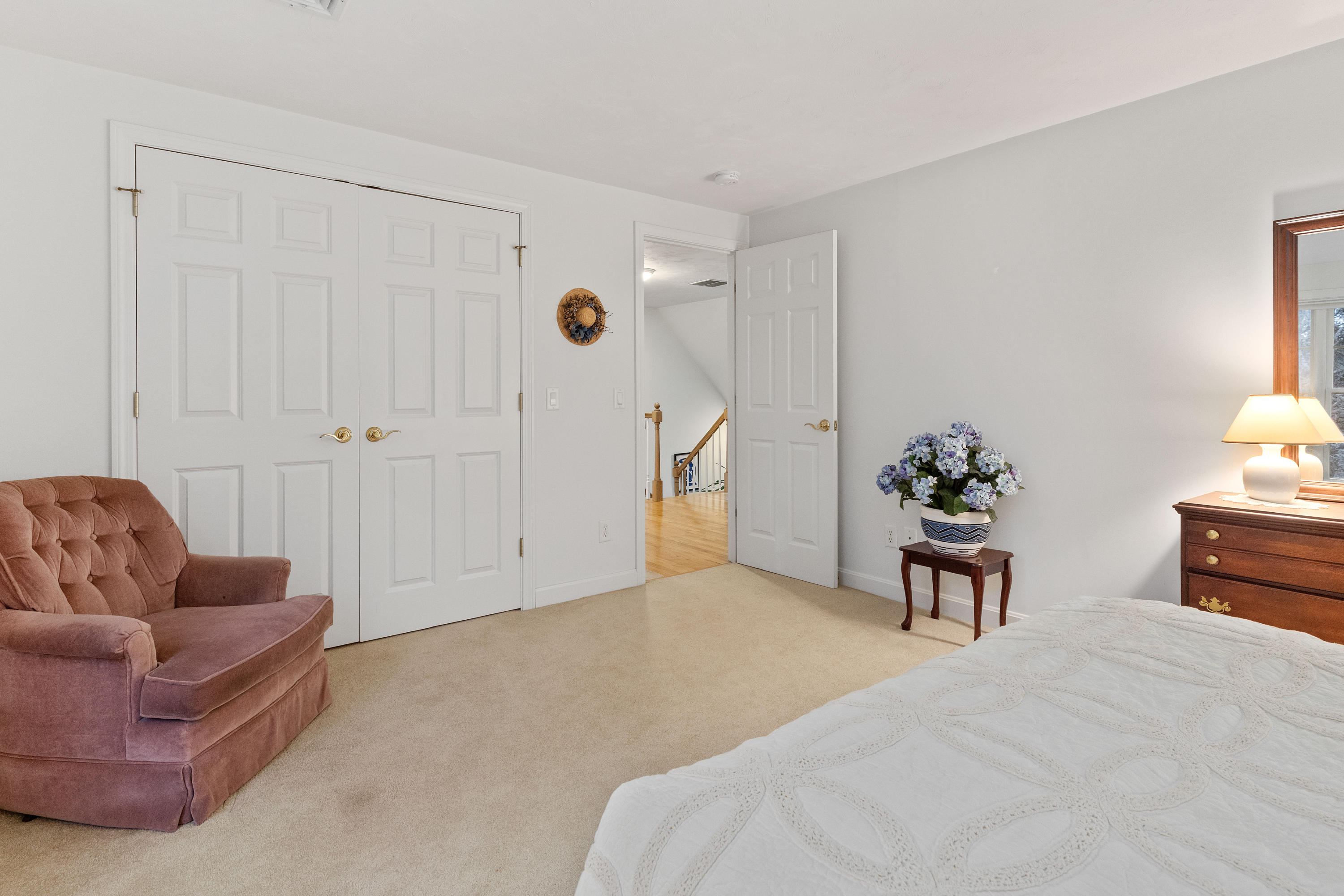3 Parsons Path Harwich, MA 02645 - Photo 28 of 62 a bedroom with furniture and a potted plant
