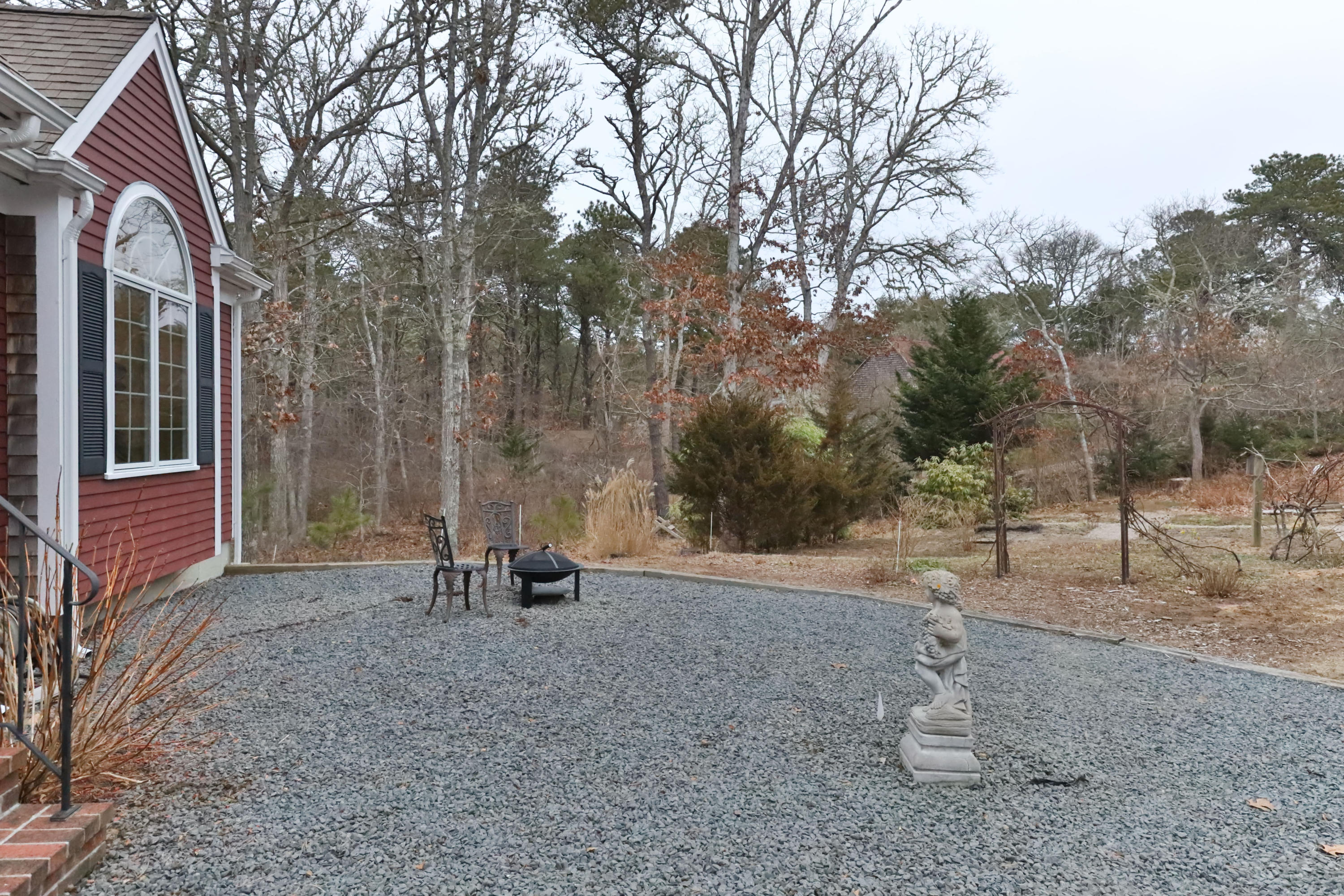 3 Parsons Path Harwich, MA 02645 - Photo 53 of 62 a backyard of a house with lots of green space