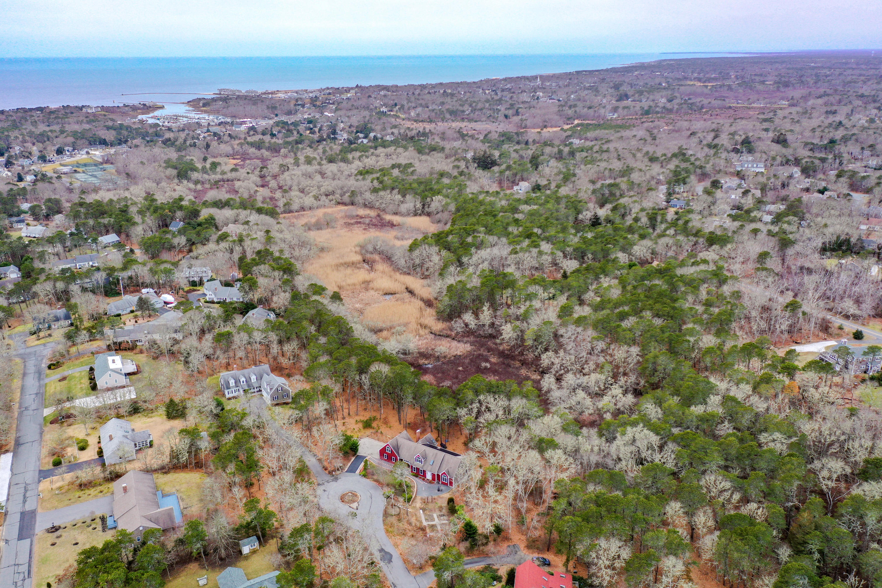3 Parsons Path Harwich, MA 02645 - Photo 55 of 62 an aerial view of a houses with a lush green hillside