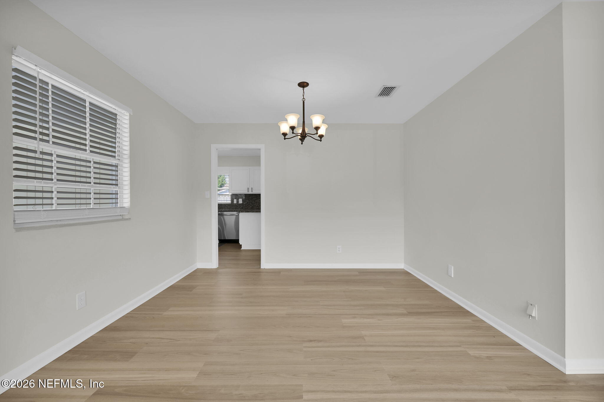 8544 Sanchez Road Jacksonville, FL 32217 - Photo 16 of 46 a view of an empty room with a window