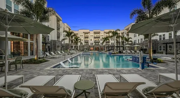 a view of pool with outdoor seating