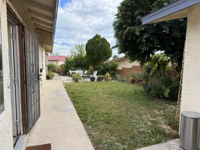 a view of a back yard of the house