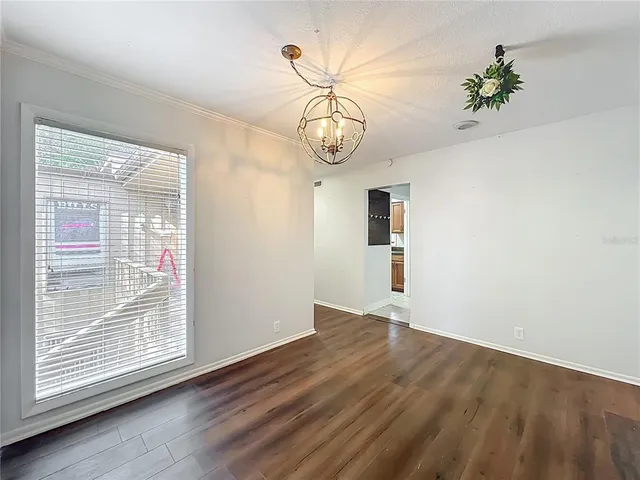 a kitchen with a sink appliances and cabinets