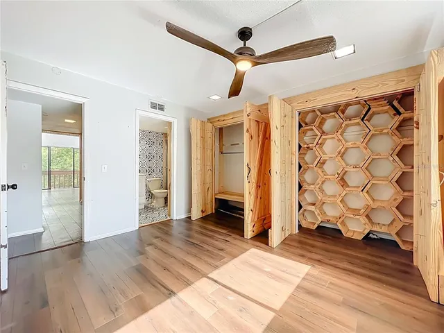 a view of a house with a yard next to a lake