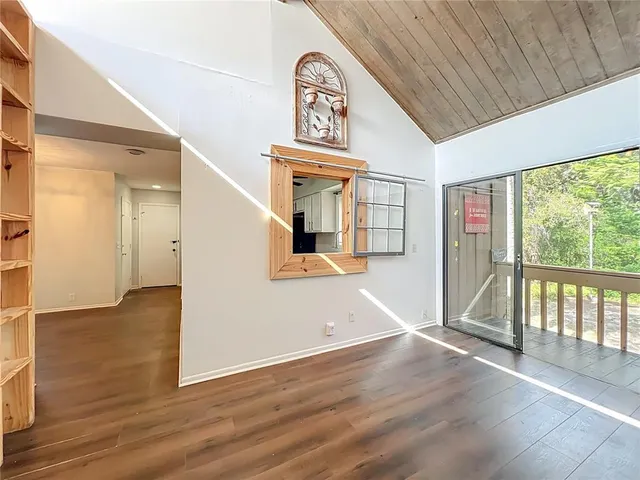 a view of a porch with wooden floor and outdoor space