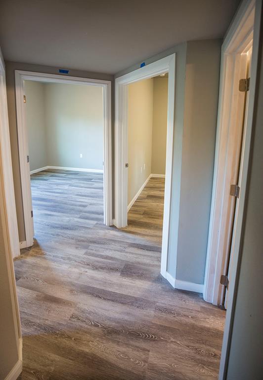 911 West 22nd Street, Unit 303 Austin, TX 78705 - Photo 11 of 23 a view of a hallway with wooden floor