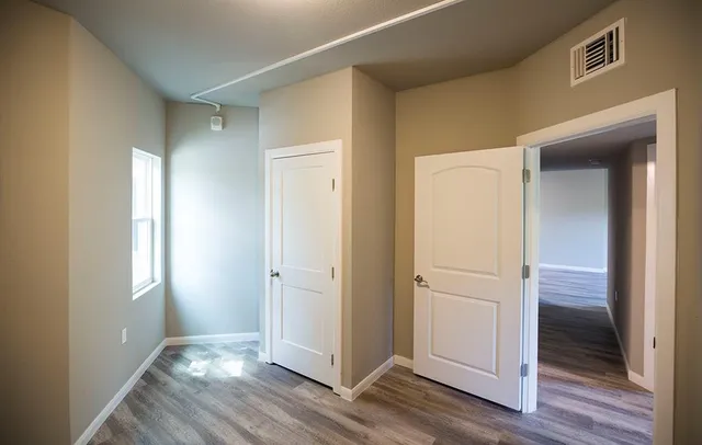 an empty room and wooden door