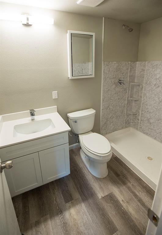 911 West 22nd Street, Unit 303 Austin, TX 78705 - Photo 17 of 23 a bathroom with a sink toilet and shower