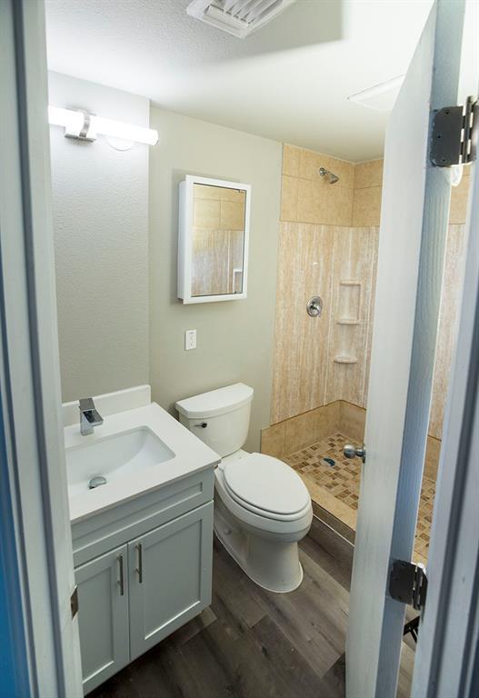911 West 22nd Street, Unit 303 Austin, TX 78705 - Photo 6 of 23 a bathroom with a sink toilet and shower