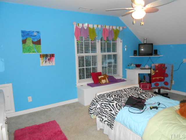 228 Sandstone Road Henderson, NC 27537 - Photo 16 of 25 Bedroom 5 with built-in corner desk and window seat.