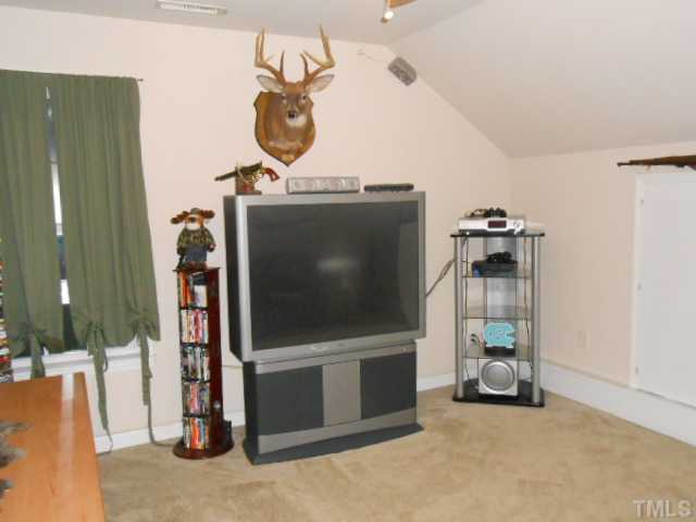 228 Sandstone Road Henderson, NC 27537 - Photo 18 of 25 Bonus room wired for surround sound and access to walk-in attic.