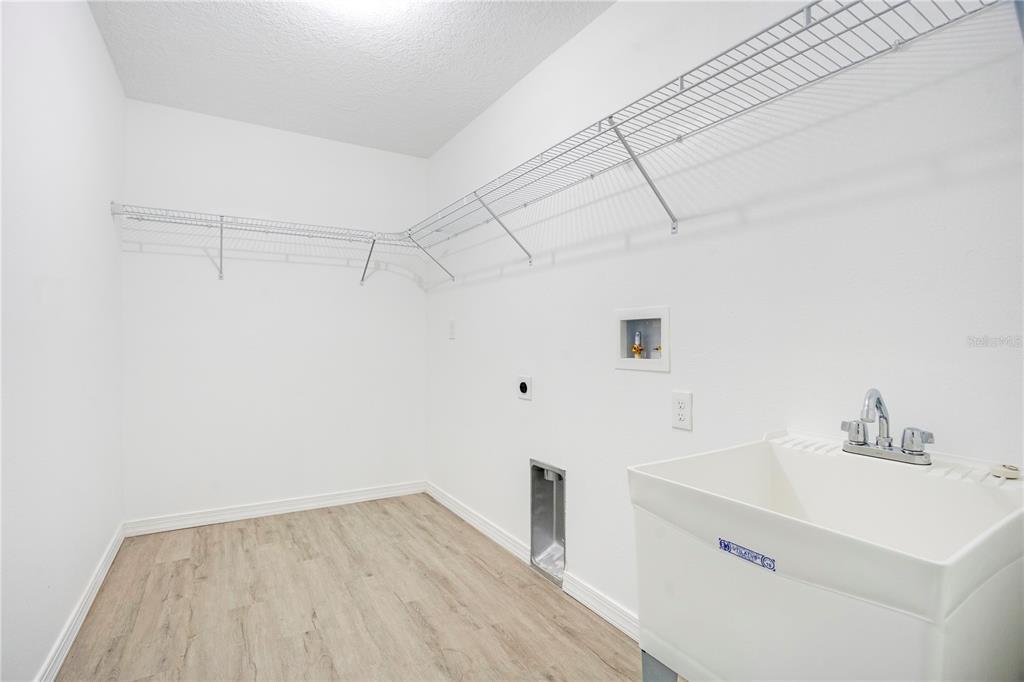 8448 Balm Street Weeki Wachee, FL 34607 - Photo 29 of 44 a bathroom with a sink and a mirror