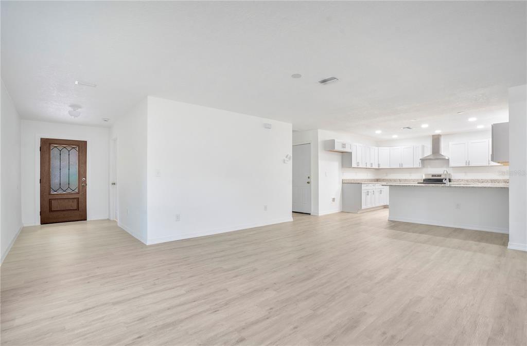 8448 Balm Street Weeki Wachee, FL 34607 - Photo 8 of 44 a view of kitchen with wooden floor