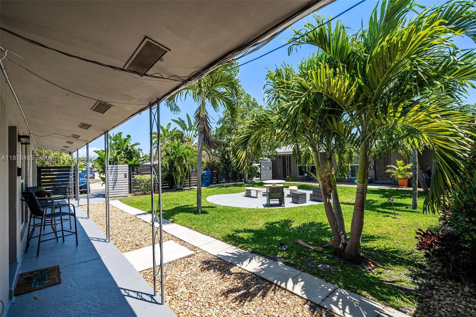2201 Northeast 14th Avenue, Unit 9 Wilton Manors, FL 33305 - Photo 20 of 30 a view of a backyard with sitting area