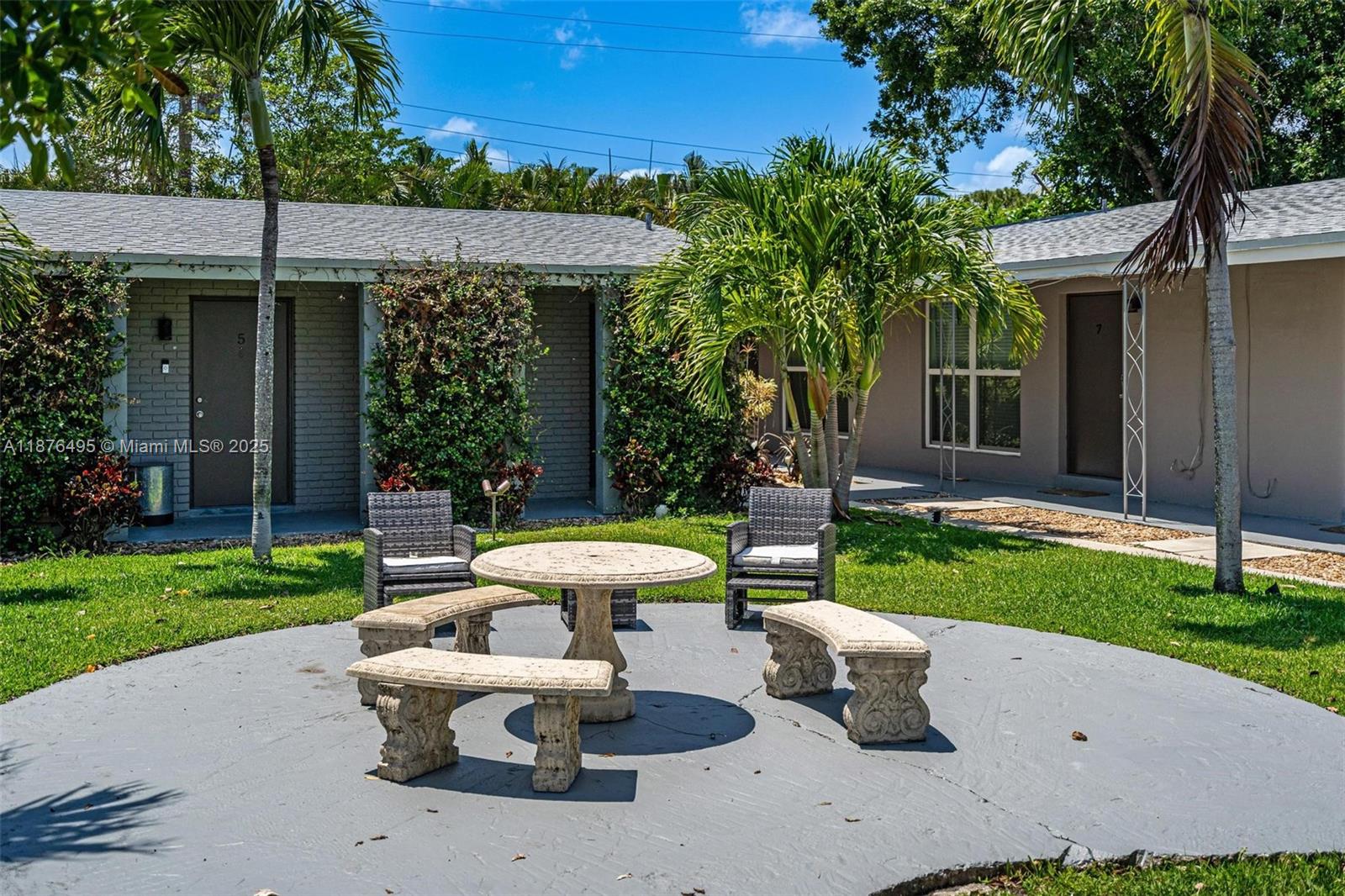 2201 Northeast 14th Avenue, Unit 9 Wilton Manors, FL 33305 - Photo 5 of 30 a view of a house with backyard sitting area and garden