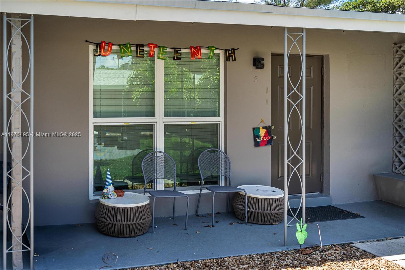 2201 Northeast 14th Avenue, Unit 9 Wilton Manors, FL 33305 - Photo 8 of 30 a living room with furniture and a potted plant
