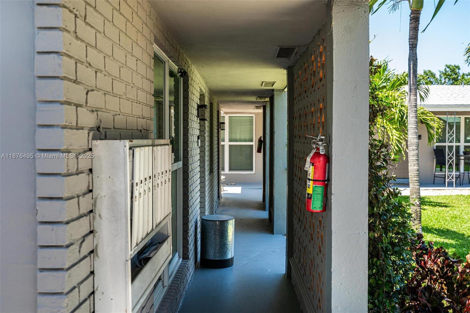 2201 Northeast 14th Avenue, Unit 9 Wilton Manors, FL 33305 - Photo 10 of 30 a front view of a house with a porch