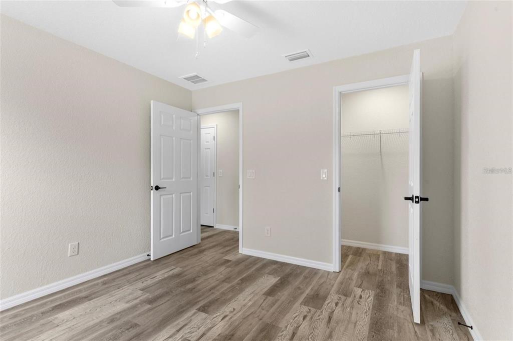 328 Eucalyptus Road Lake Wales, FL 33898 - Photo 16 of 18 a view of an empty room with wooden floor