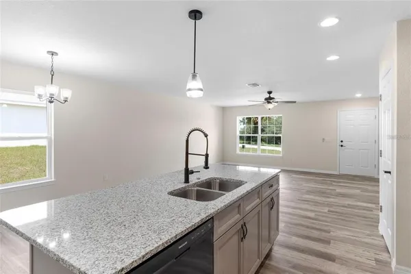a kitchen with sink cabinets and window