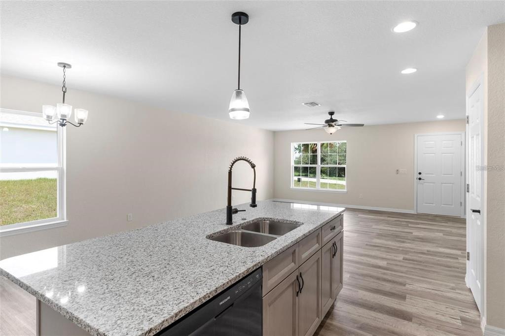 328 Eucalyptus Road Lake Wales, FL 33898 - Photo 8 of 18 a kitchen with sink cabinets and window