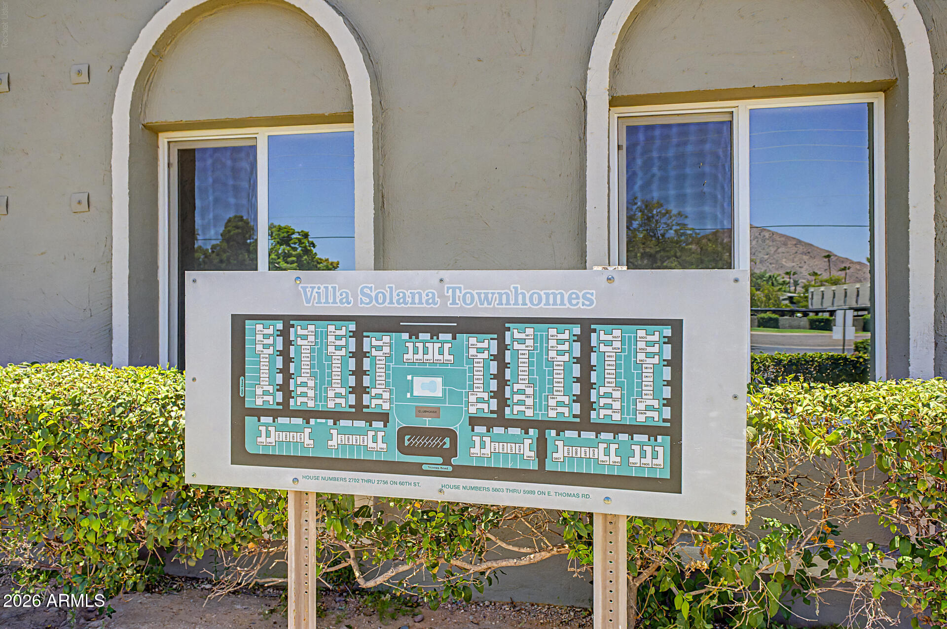 5873 East Thomas Road Scottsdale, AZ 85251 - Photo 27 of 30 a front view of a house with a garden