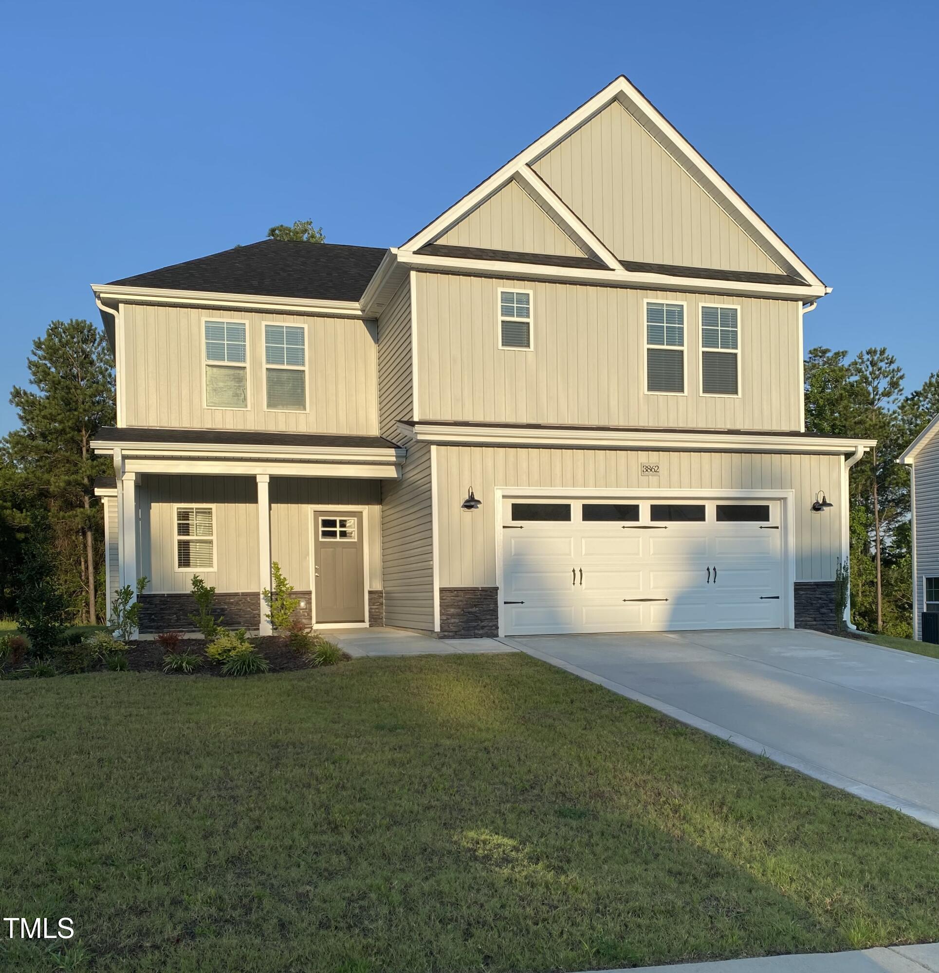 3862 Blackhills Road Fayetteville, NC 28311 - Photo 1 of 15 a front view of a house with a yard and trees