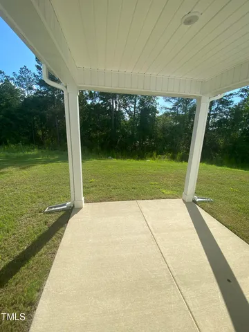 a view of porch with a yard