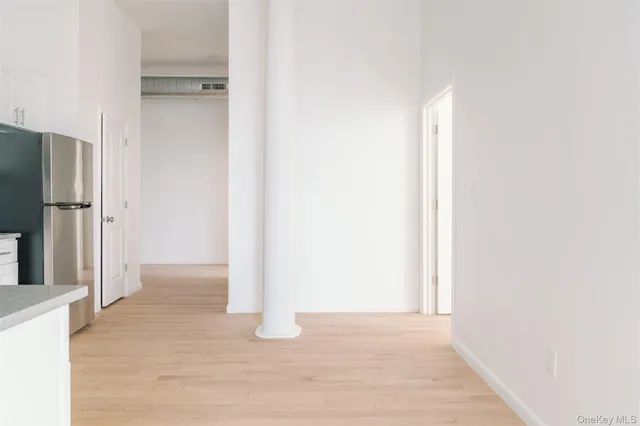 a view of a kitchen with a refrigerator