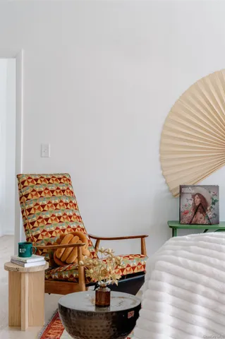 a view of a room with a book shelf