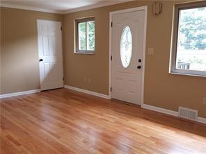 3496 Evergreen Road Pittsburgh, PA 15237 - Photo 5 of 23 an empty room with windows and mirror