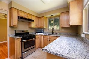 3496 Evergreen Road Pittsburgh, PA 15237 - Photo 8 of 23 a kitchen with stainless steel appliances granite countertop a stove a sink and a microwave