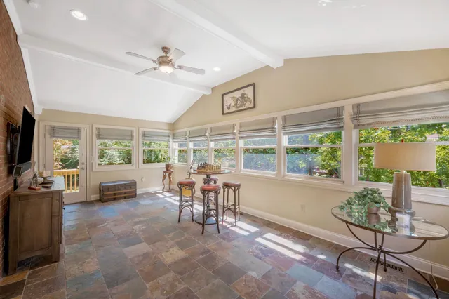 a view of a livingroom with furniture window and outside view