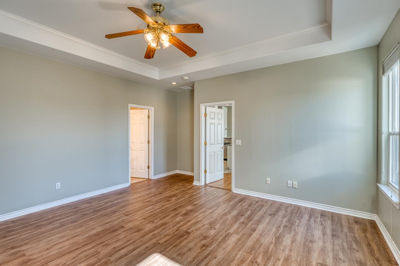 2804 Oak Ridge Drive Horseshoe Bay, TX 78657 - Photo 13 of 30 a view of empty room with wooden floor
