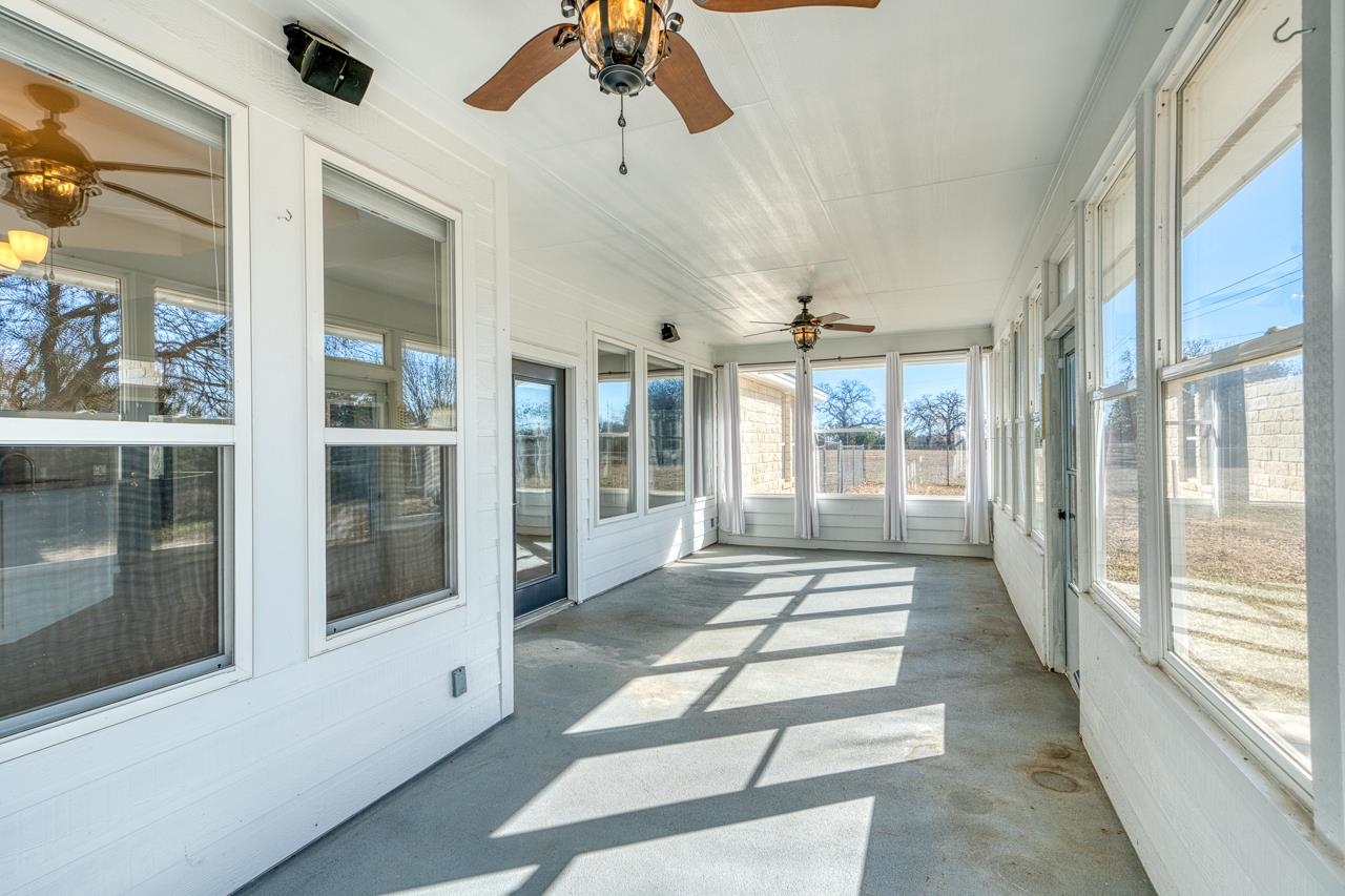 2804 Oak Ridge Drive Horseshoe Bay, TX 78657 - Photo 21 of 30 a lobby with furniture and large windows