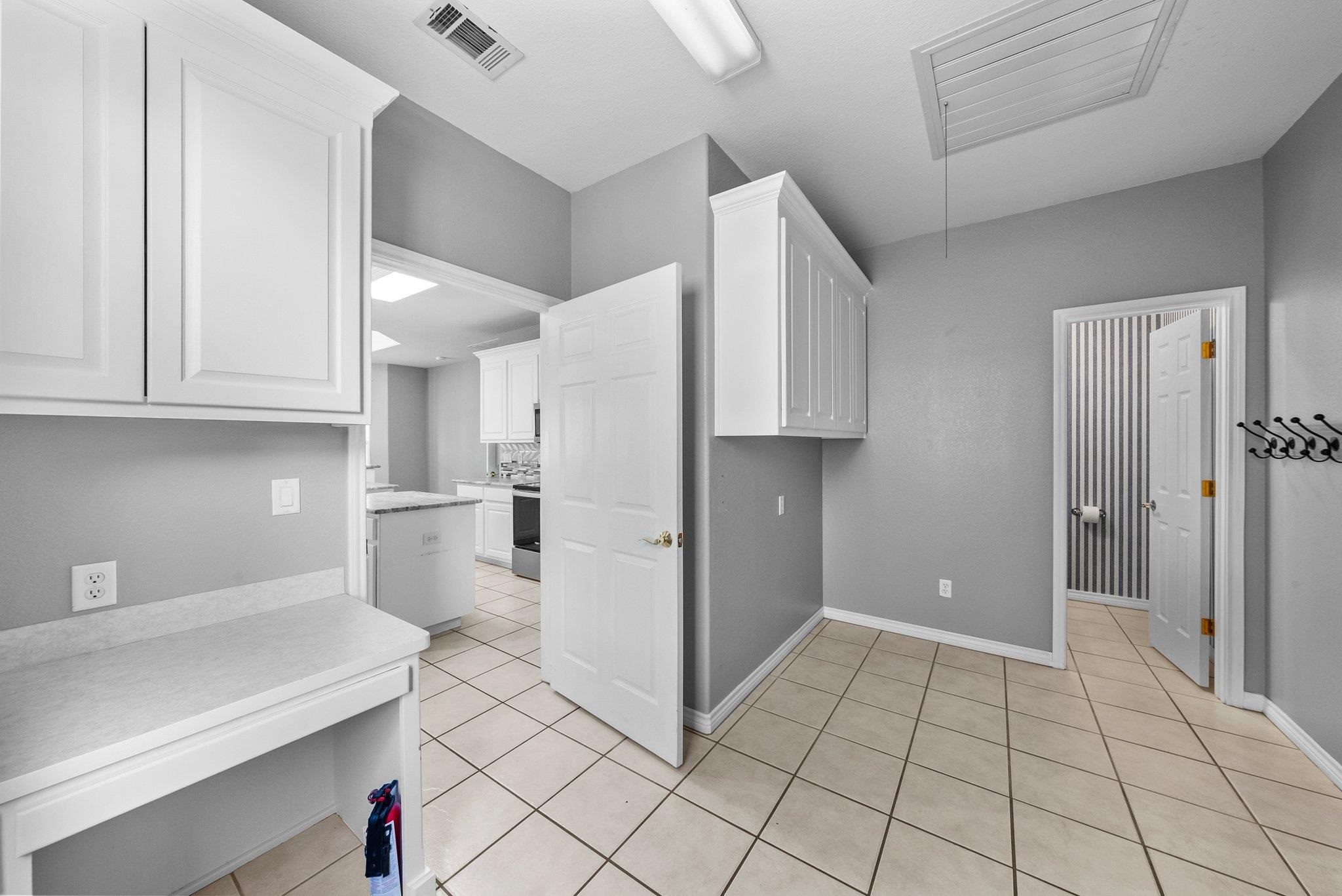 2804 Oak Ridge Drive Horseshoe Bay, TX 78657 - Photo 23 of 30 a view of kitchen with white cabinets