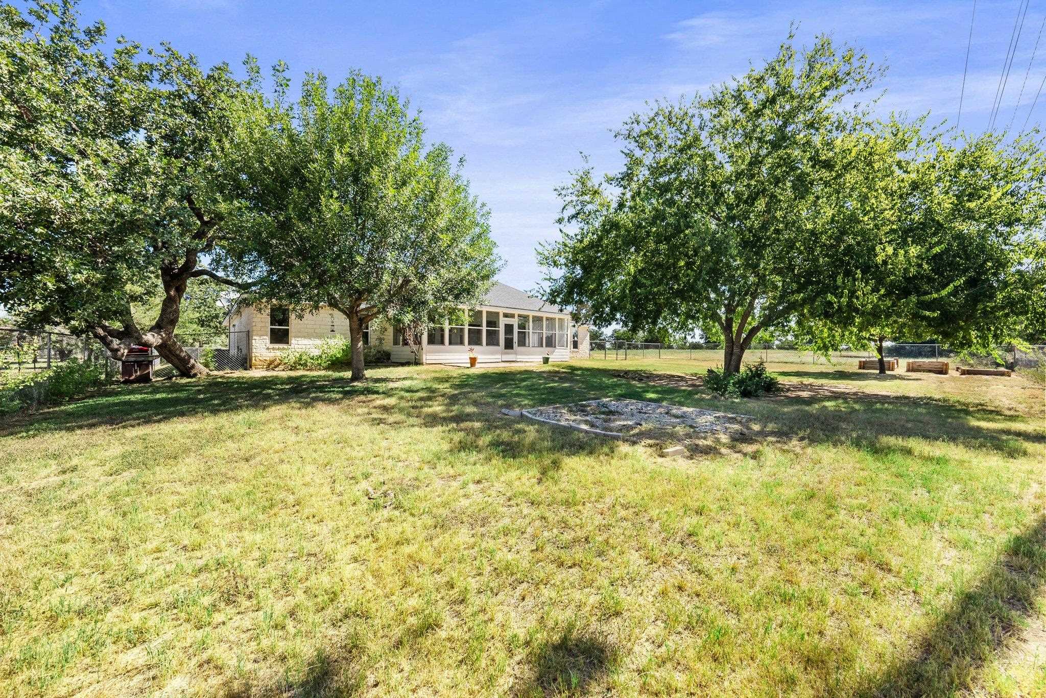 2804 Oak Ridge Drive Horseshoe Bay, TX 78657 - Photo 25 of 30 a view of a swimming pool with a house in the background