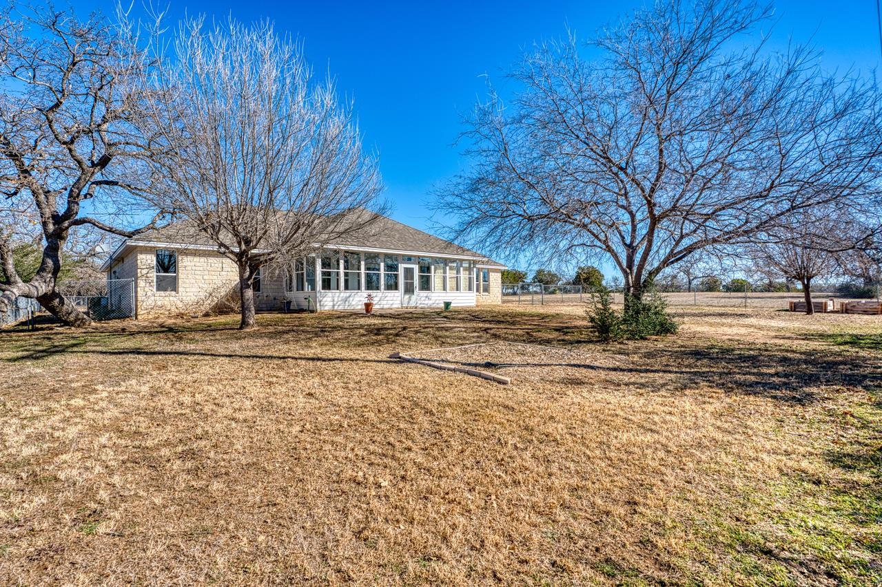 2804 Oak Ridge Drive Horseshoe Bay, TX 78657 - Photo 26 of 30 a view of large house with a yard