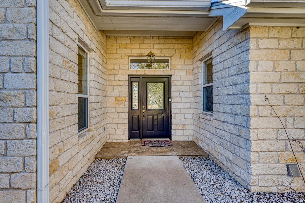 2804 Oak Ridge Drive Horseshoe Bay, TX 78657 - Photo 3 of 30 a view of a front door of a house with stairs