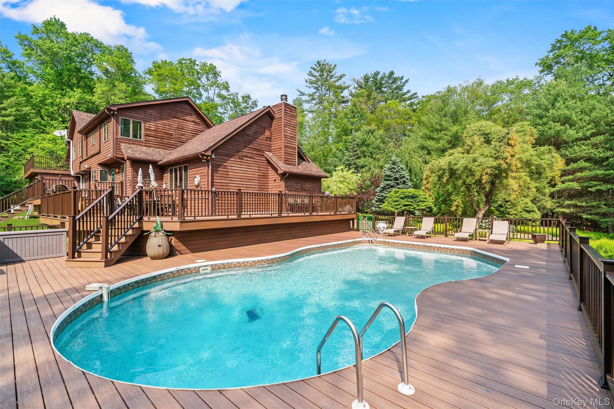 1775 Plank Rd Section A Forestburgh, NY 12777 - Photo 36 of 50 View of swimming pool with a deck and view of scattered trees