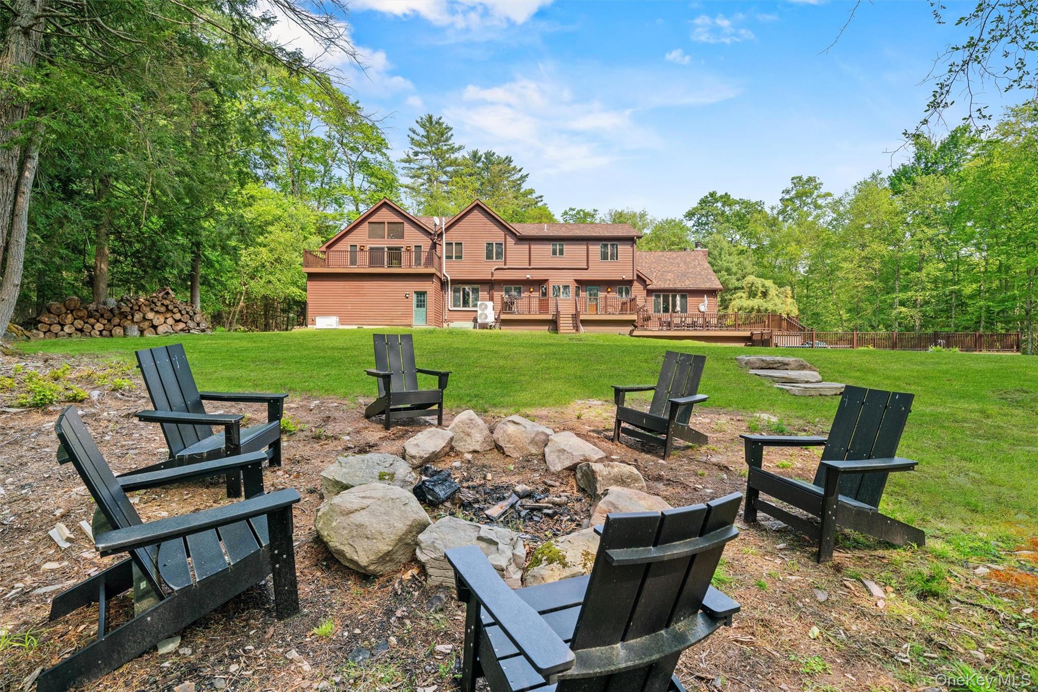 1775 Plank Rd Section A Forestburgh, NY 12777 - Photo 37 of 50 View of green lawn featuring a fire pit and a wooden deck